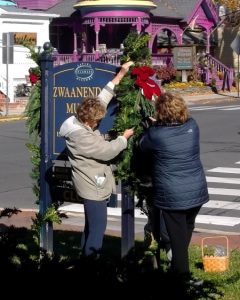 Members of the Sussex Gardners decorating the Zwaanendael Museum