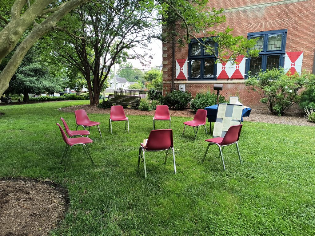A circle of chairs is set up for participants in the "Mock Freedom: Delaware's Black Codes" program held on Juneteenth 2023 outside of the Zwaanendael Museum in Lewes.