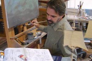 Artist Patrick O'Brien is shown painting on a canvas.