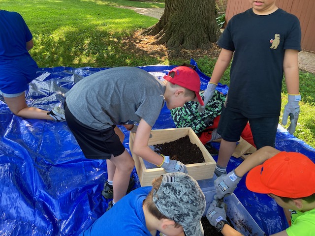 A small group of participants ages 10-13 participate in an archaeology portion of the second annual New Castle History Summer Camp.