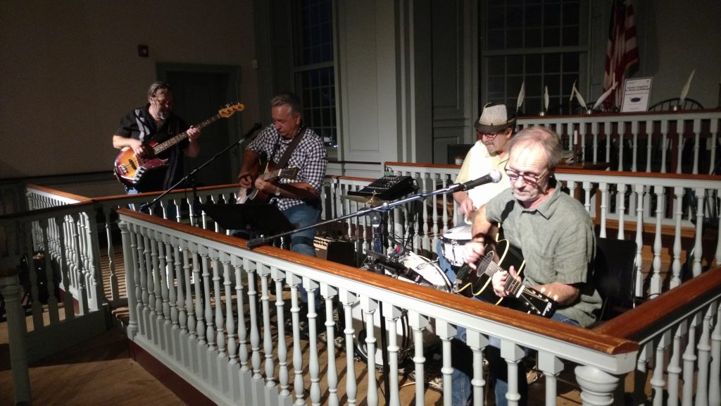 Local eelctric blues band Bad Juju performs an acoustic set at a live concert at The Old State House.