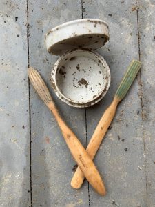 Historic toothbrushes and a container found in a historic privy at Buena Vista.