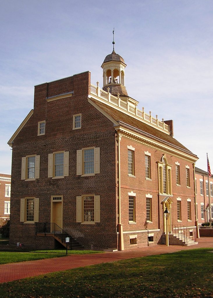 Photo of the Old State House exterior - a red brick building with white windows and a bell tower