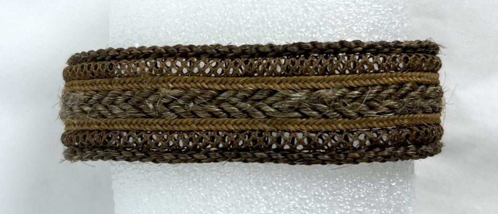 A picture of braided hair in four different styles to create the band of a bracelet.