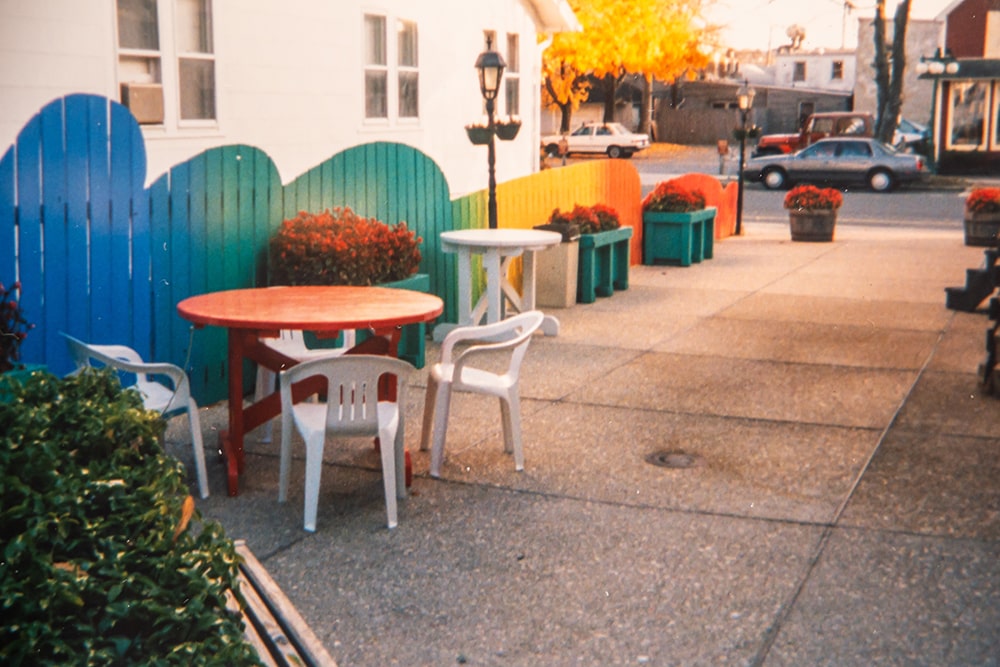 A courtyard with a rainbow-colored fence.