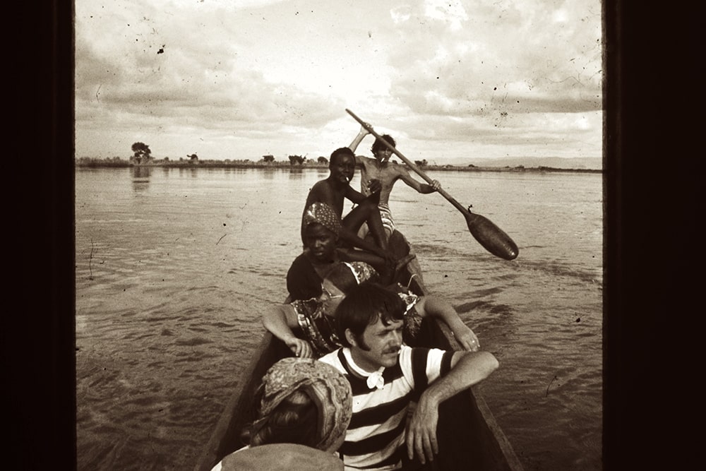 Six people travel in a boat.