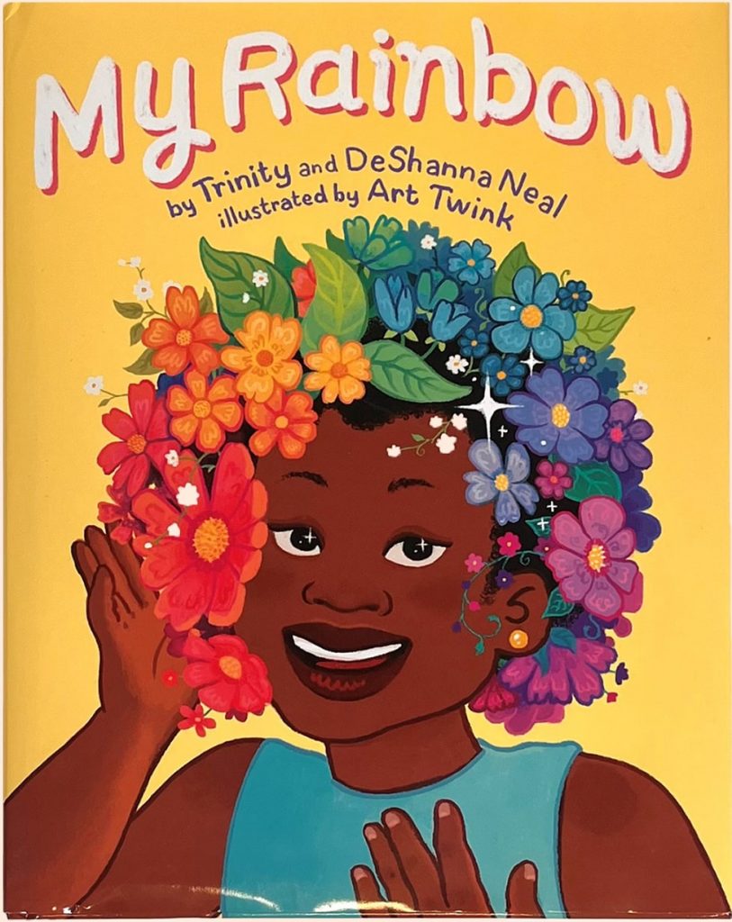 An illustration of a smiling Black girl wearing a rainbow flower crown.