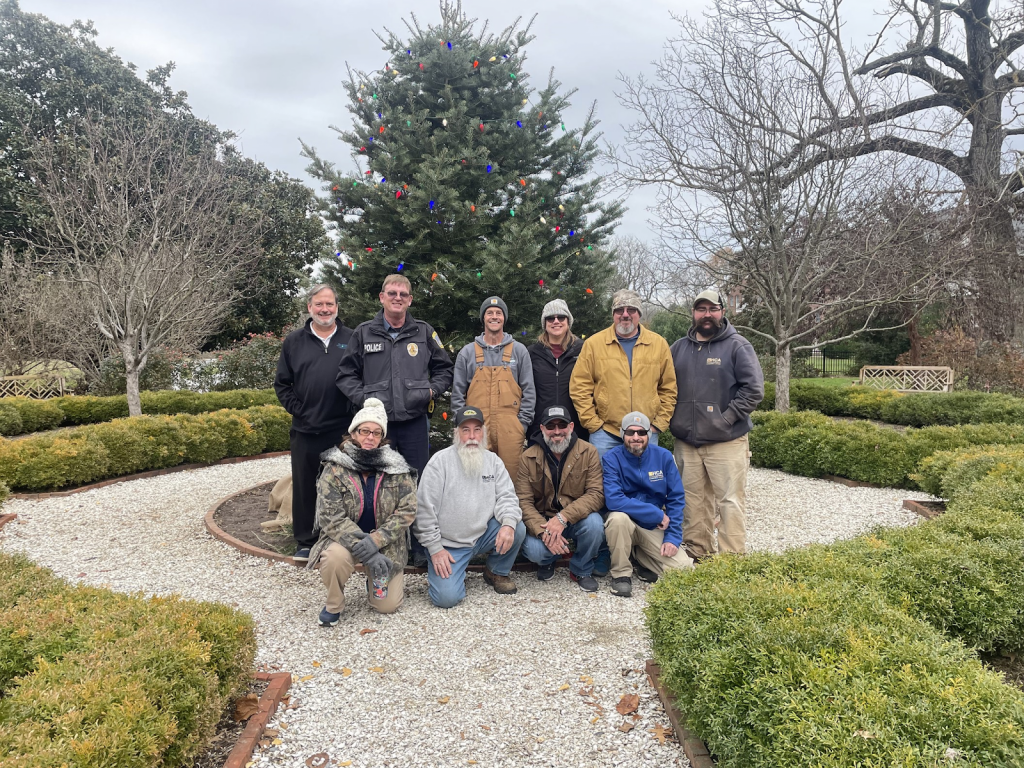 HCA staff of holidays past, decorating the greenery at historic sites like Woodburn