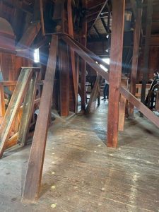 An interior view of the historic Cooch Dayett Mill shows wooden floors, beams and walkways that pose challenges to accessibility.