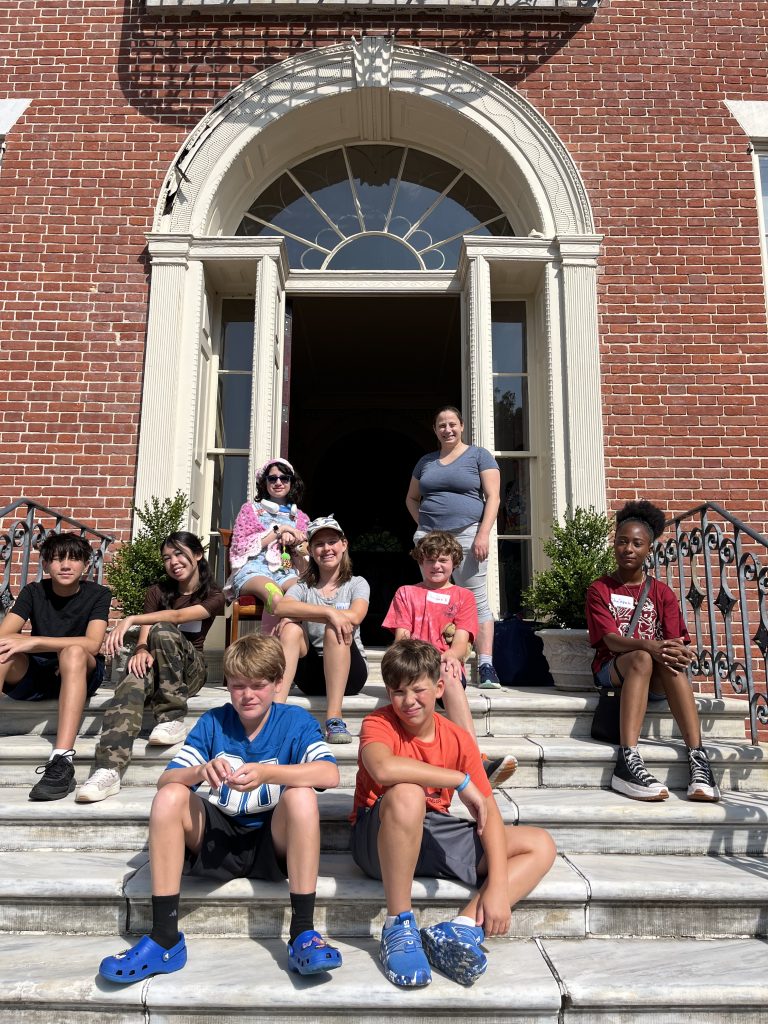 Students and history staff pose for a group photo during a summer history camp in Old New Castle.