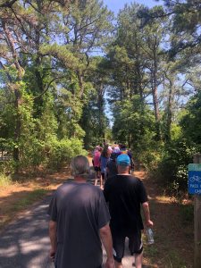Tour participants hike through Cape Henlopen State Park
