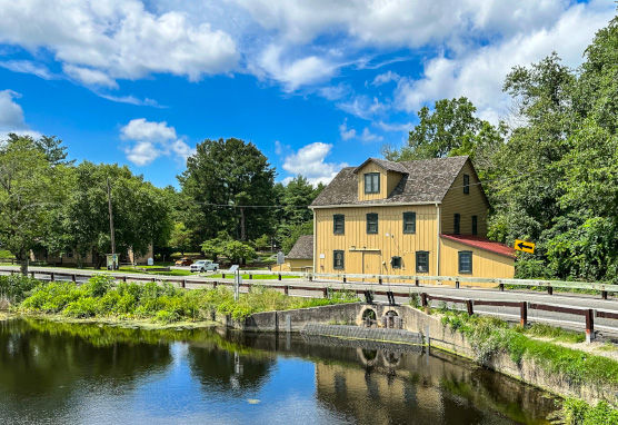 Abbott's Mill sitting by a road that lines Abbott's Pond.