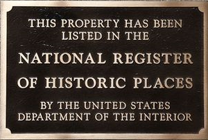 Bronze plaque stating: "This property has been listed in the National Register of Historic Places by the United States Department of the Interior."