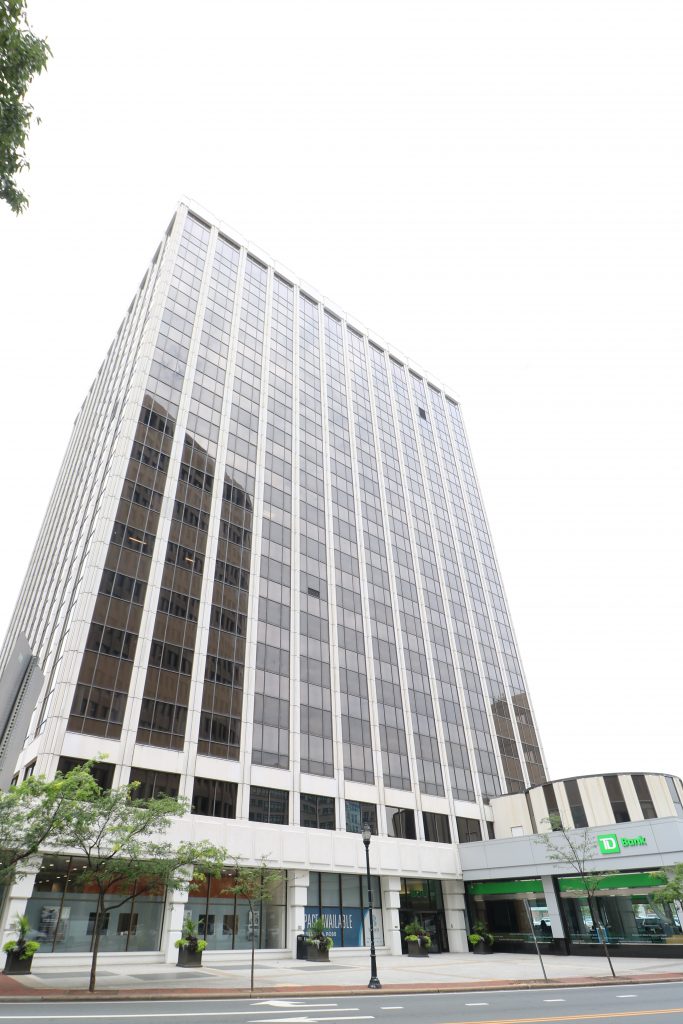 Exterior of 17 story modern office building taken from across the street.