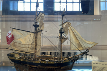 A model ship that is two-feet tall.