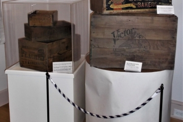 A section of the Delaware Railroads exhibit featuring shipping crates on pedestals