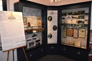 Exhibit cases in corner of railroad exhibit.