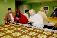 Women working on quilt